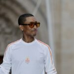 Pharrell Williams carries the torch at the 2024 Paris Olympics