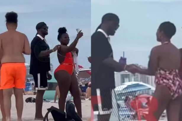 Diddy takes pictures and chats with women on Miami Beach