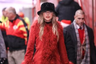 Taylor Swift arrives at the Chiefs Game rocking a red faux fur coat